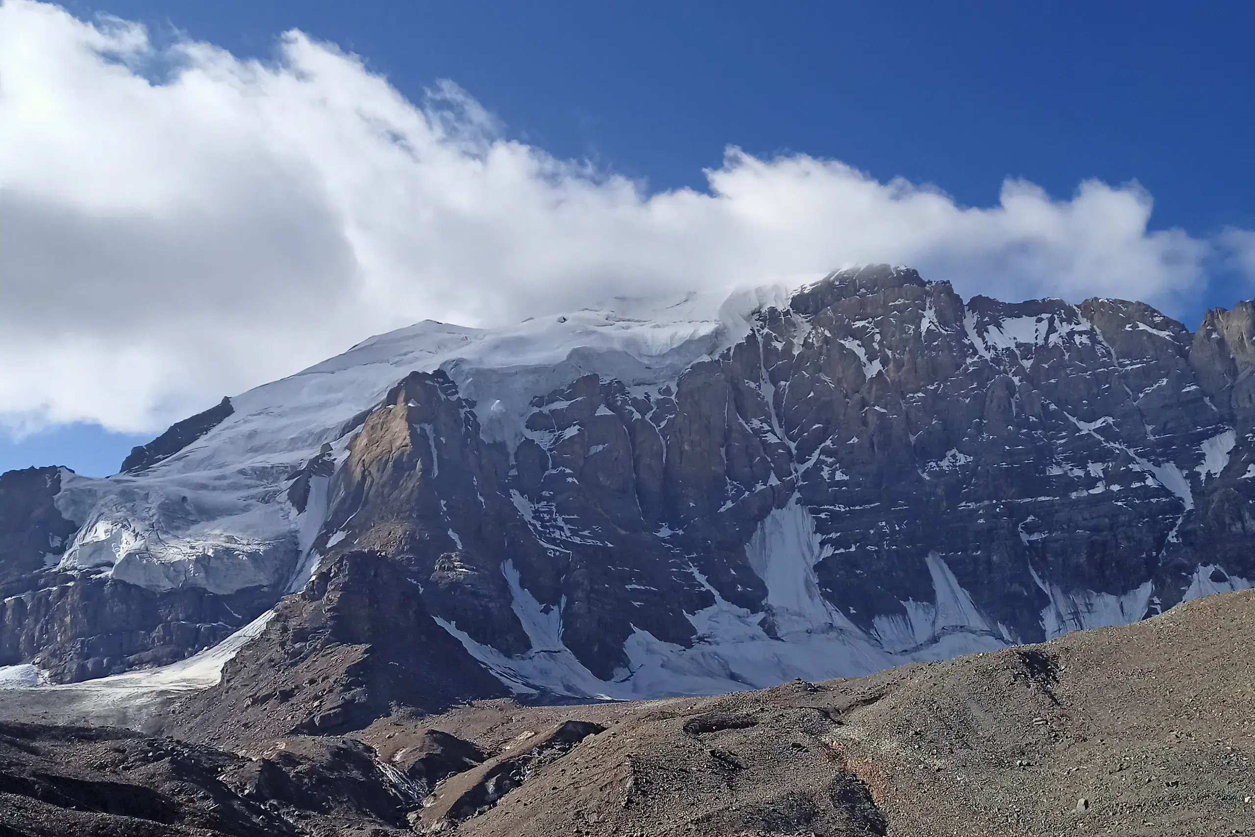 A glacier below a snow-covered summit in northern Pakistan.