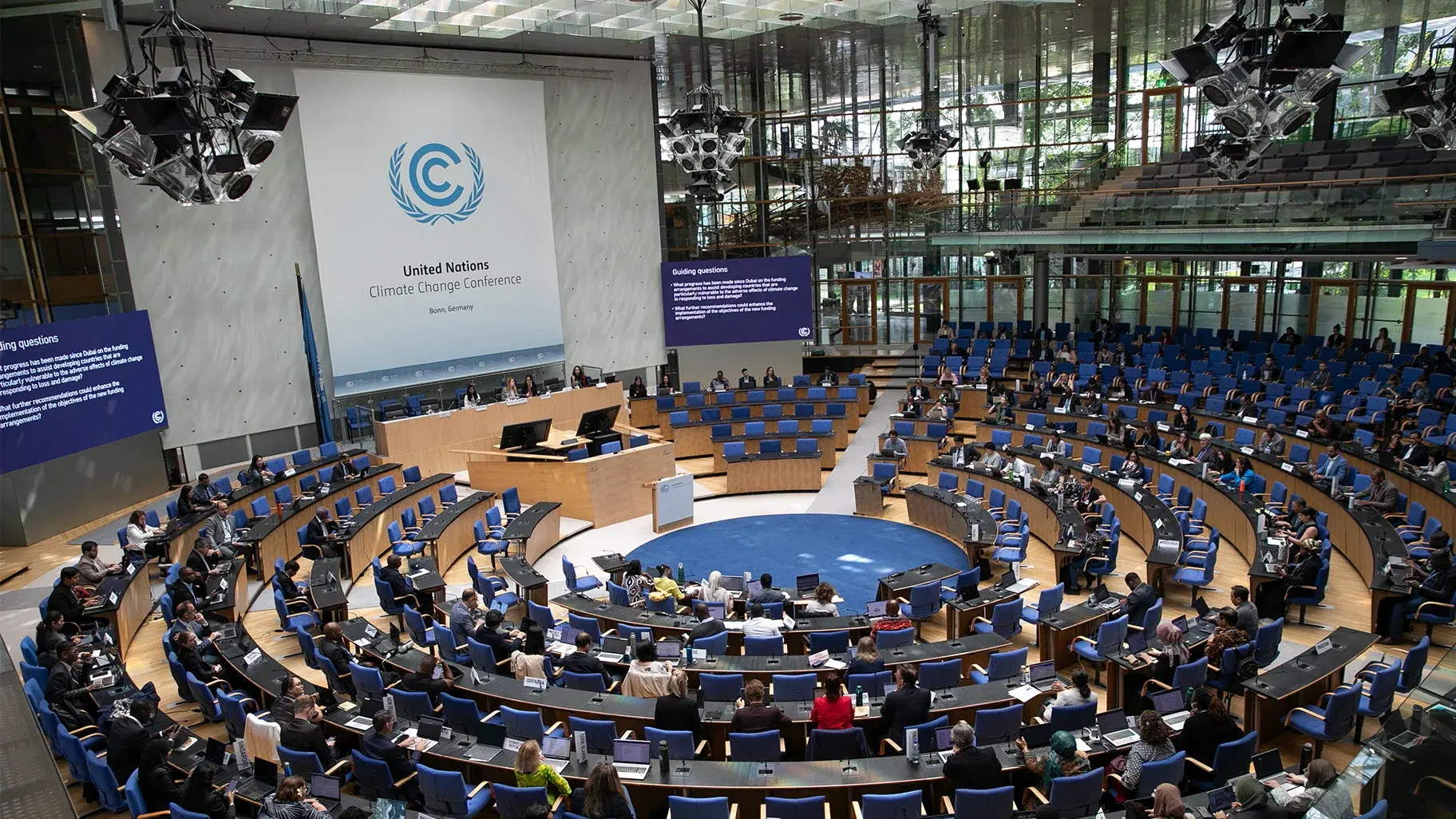 The plenary hall at the United Nations Climate Change Conference in Bonn, Germany, with delegates seated in the round.